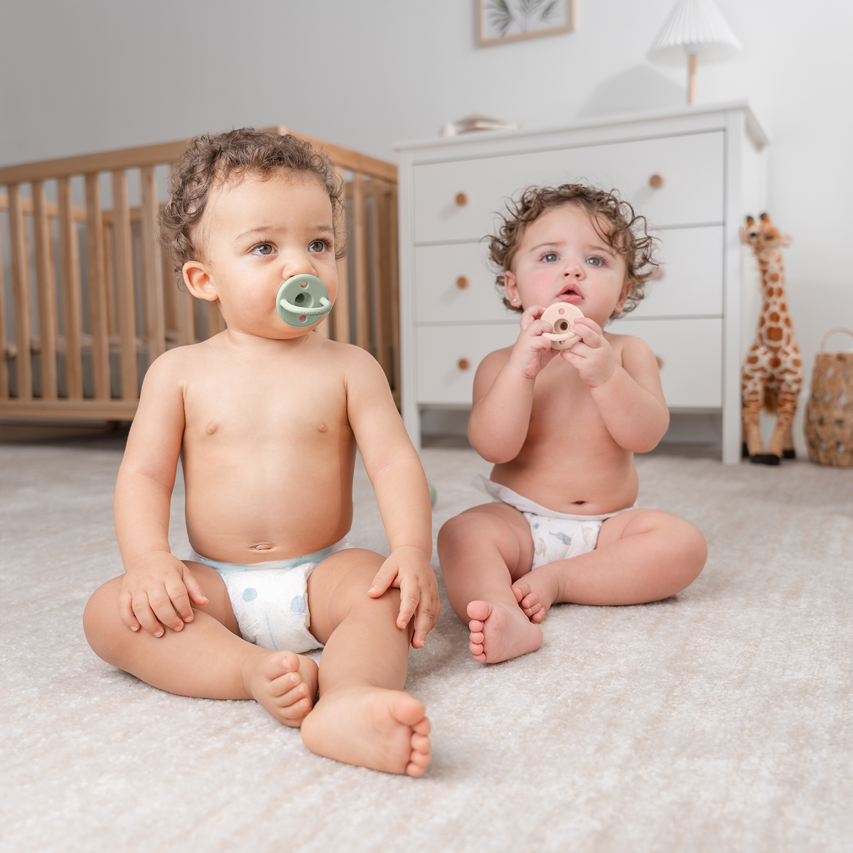 Babies using neutral silicone pacifiers