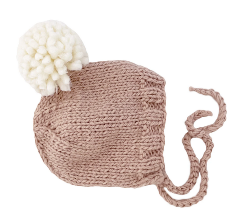 Baby knit bonnet hat with white pom pom, mocha, front view