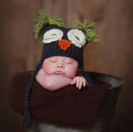 Baby knit owl hat, charcoal grey & green, worn by baby