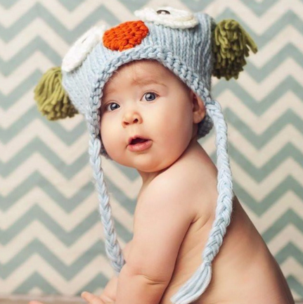 Baby knit owl hat, sky blue and green, worn by baby