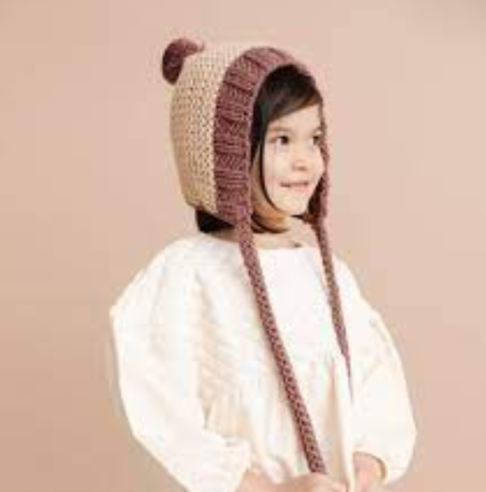 Baby knit pom pom bonnet hat, brown hazelnut, worn by child