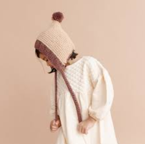 Baby knit pom pom bonnet hat, brown hazelnut, worn side view
