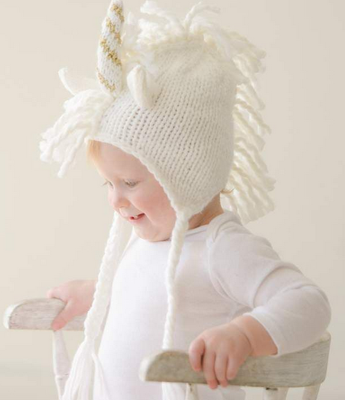 Baby knit unicorn hat, white and gold, worn by baby