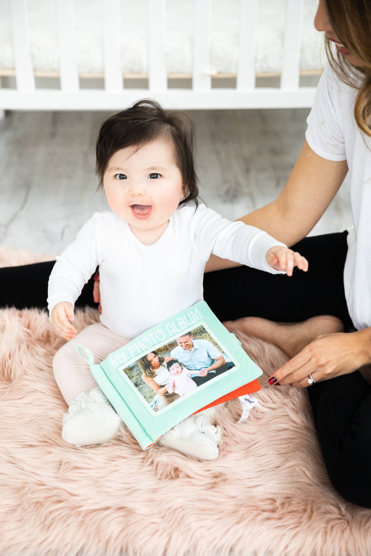 Baby's first soft photo album, mint blue, with baby