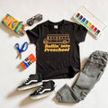Rollin into Preschool black graphic tee, flat lay with school supplies