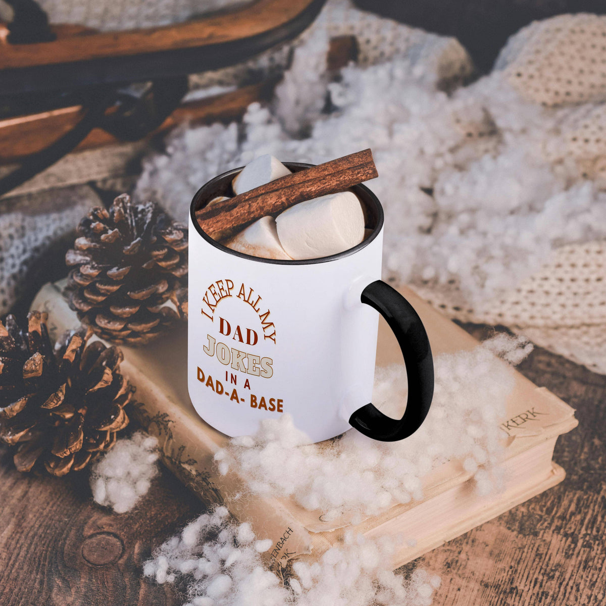 I Keep All My Dad Jokes In a Dad-A-Base heat changing mug, on a table with a cozy blanket