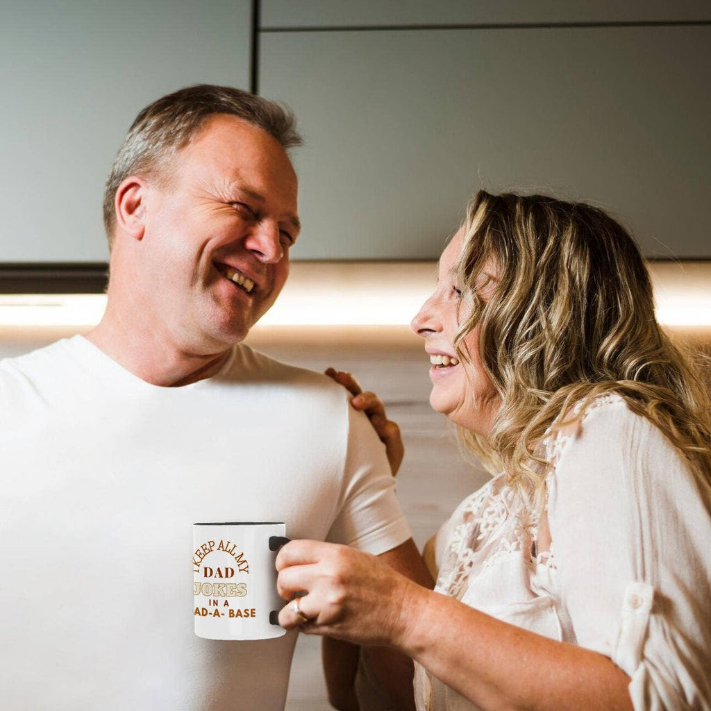 Couple laughing with the Dad-A-Base mug