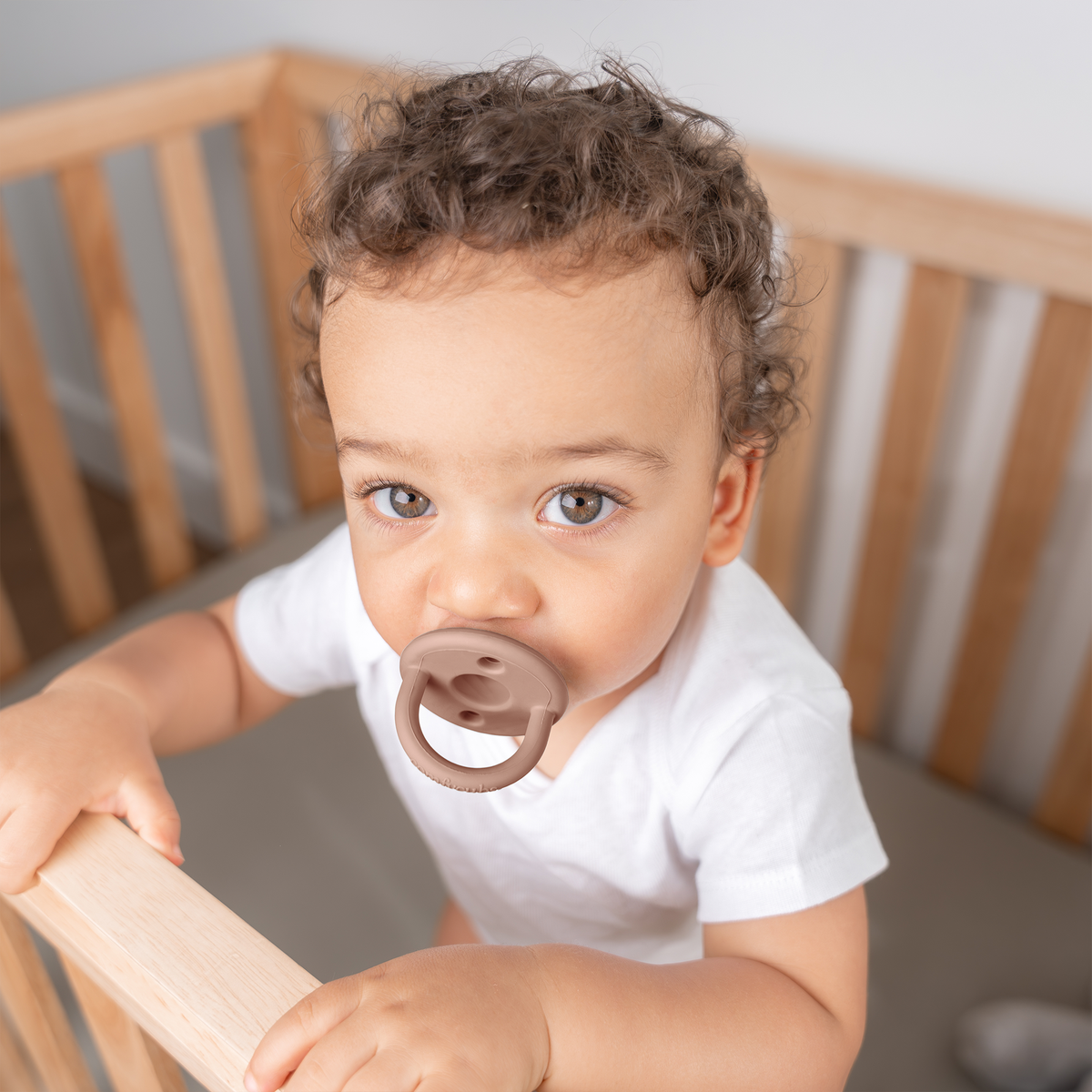Baby with a neutral silicone pacifier