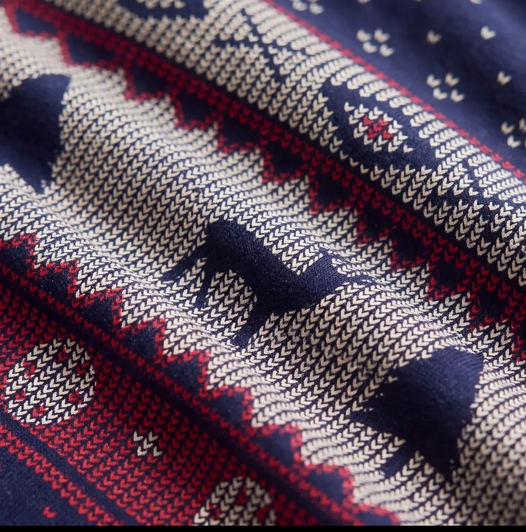 Close-up of the navy Fair Isle knit-look reindeer print in cream, red and tan