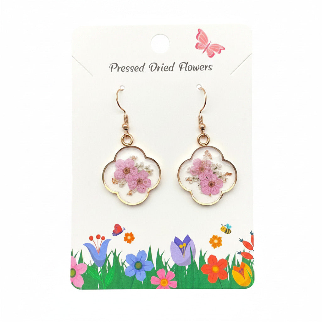 Rose gold pink pressed flower clover dangle earrings, on their pressed dried flowers card