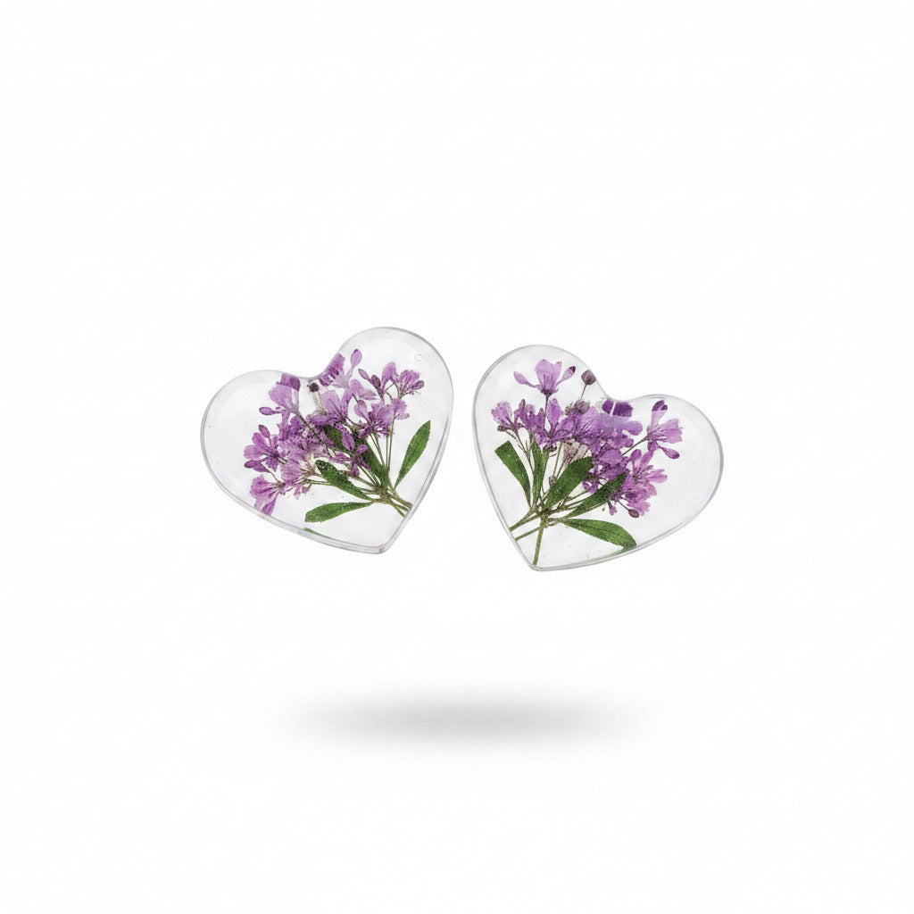Purple pressed flower resin heart stud earrings, on a white background
