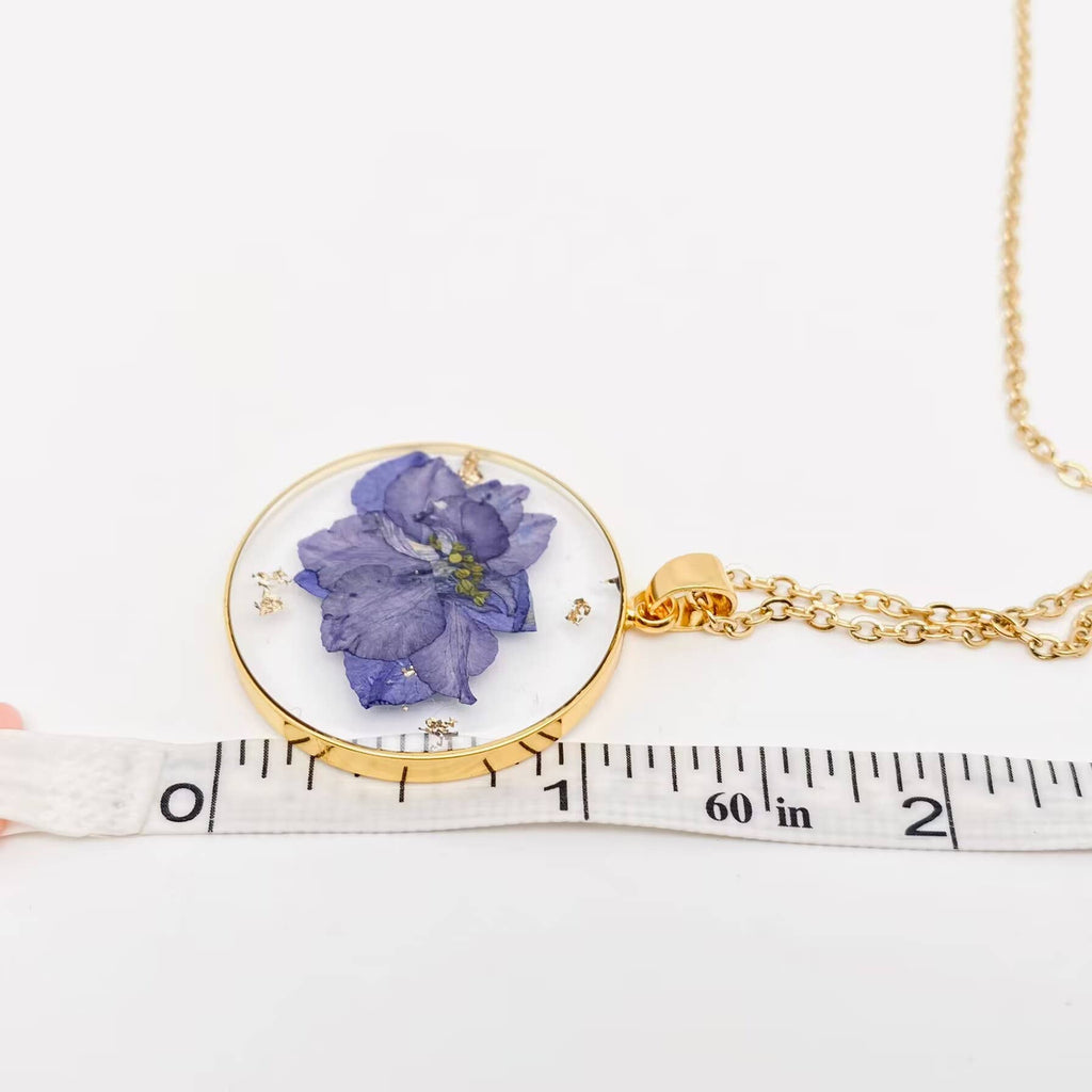 Purple pressed delphinium round pendant necklace, pendant measured with a tape measure
