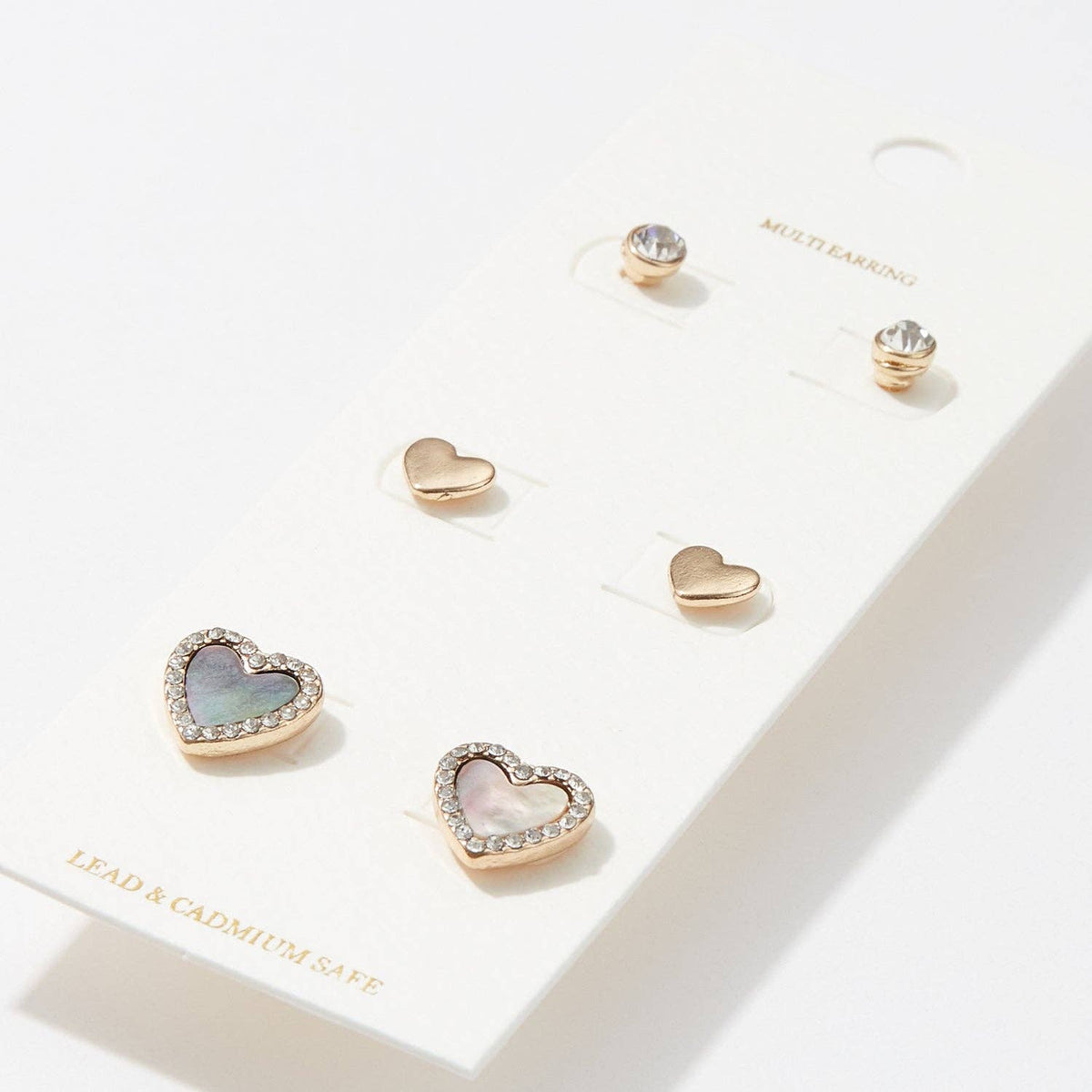 Heart and stud earring set of 3 with mother of pearl and gold, close up