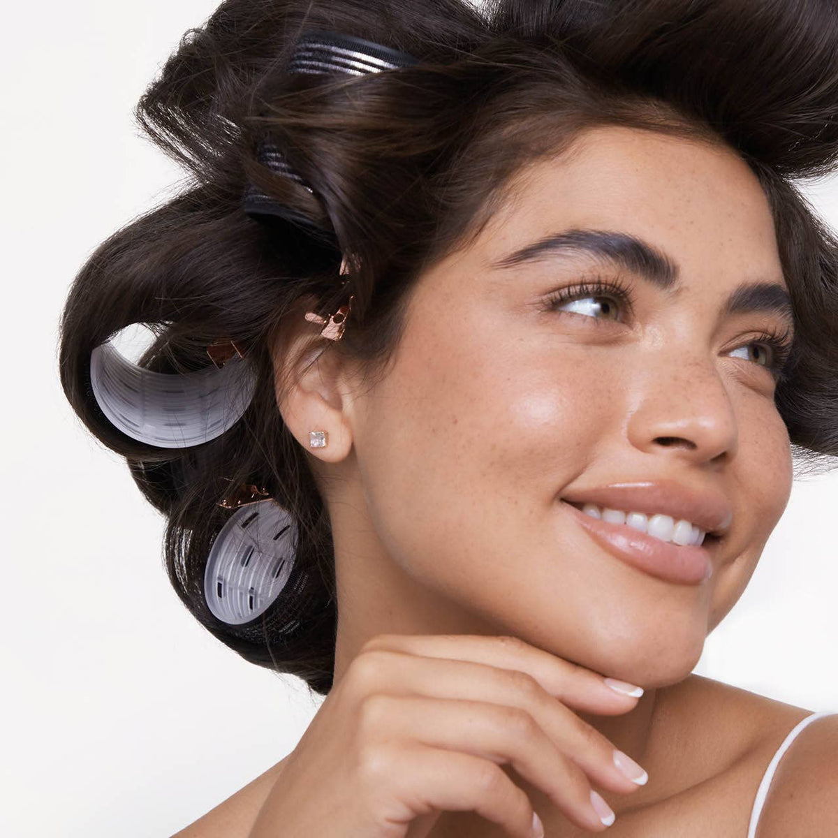 Kitsch black ceramic thermal hair rollers, rollers in a woman's hair
