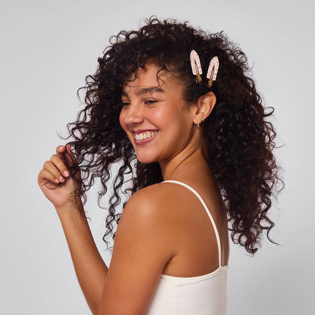 Kitsch cherry print creaseless hair clips, worn by a woman