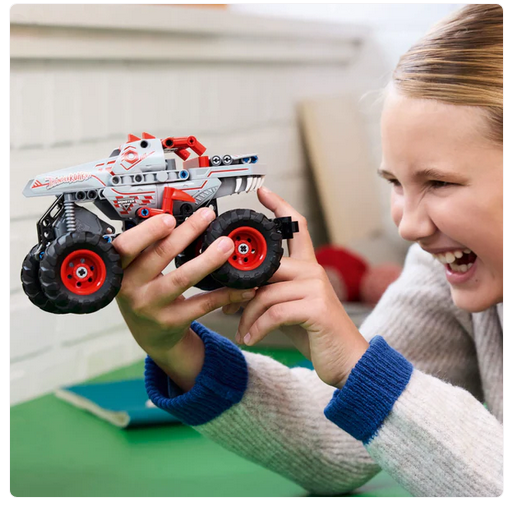 Child playing with the LEGO Technic Monster Jam truck