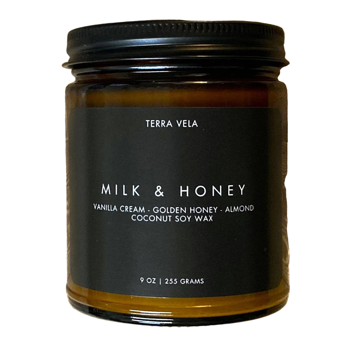 Milk & Honey soy candle in a 9 oz amber glass jar with a black lid and label