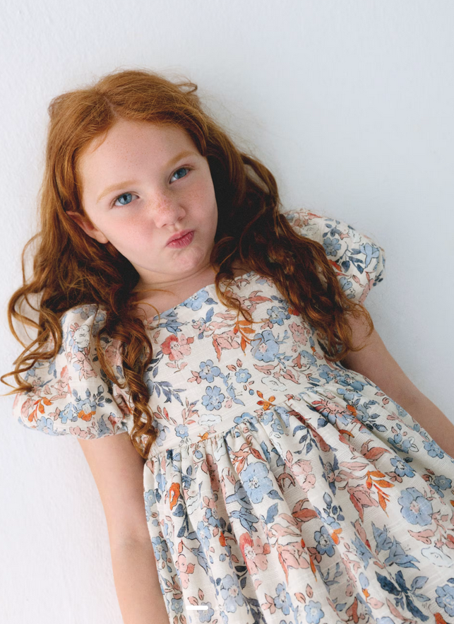 Mayoral girls salmon and ocean blue floral puff sleeve dress, close-up on a girl