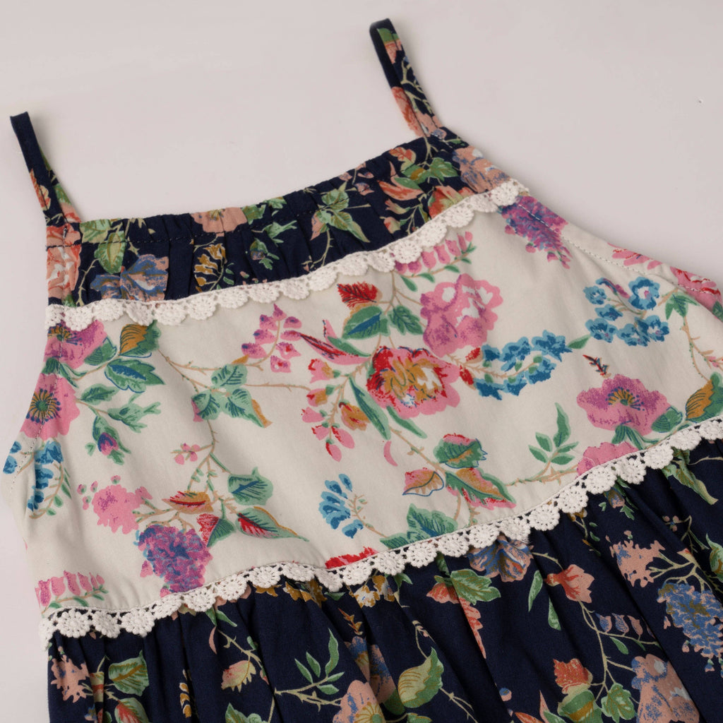 Girls mixed floral babydoll dress with crochet lace trim, close-up of the bodice