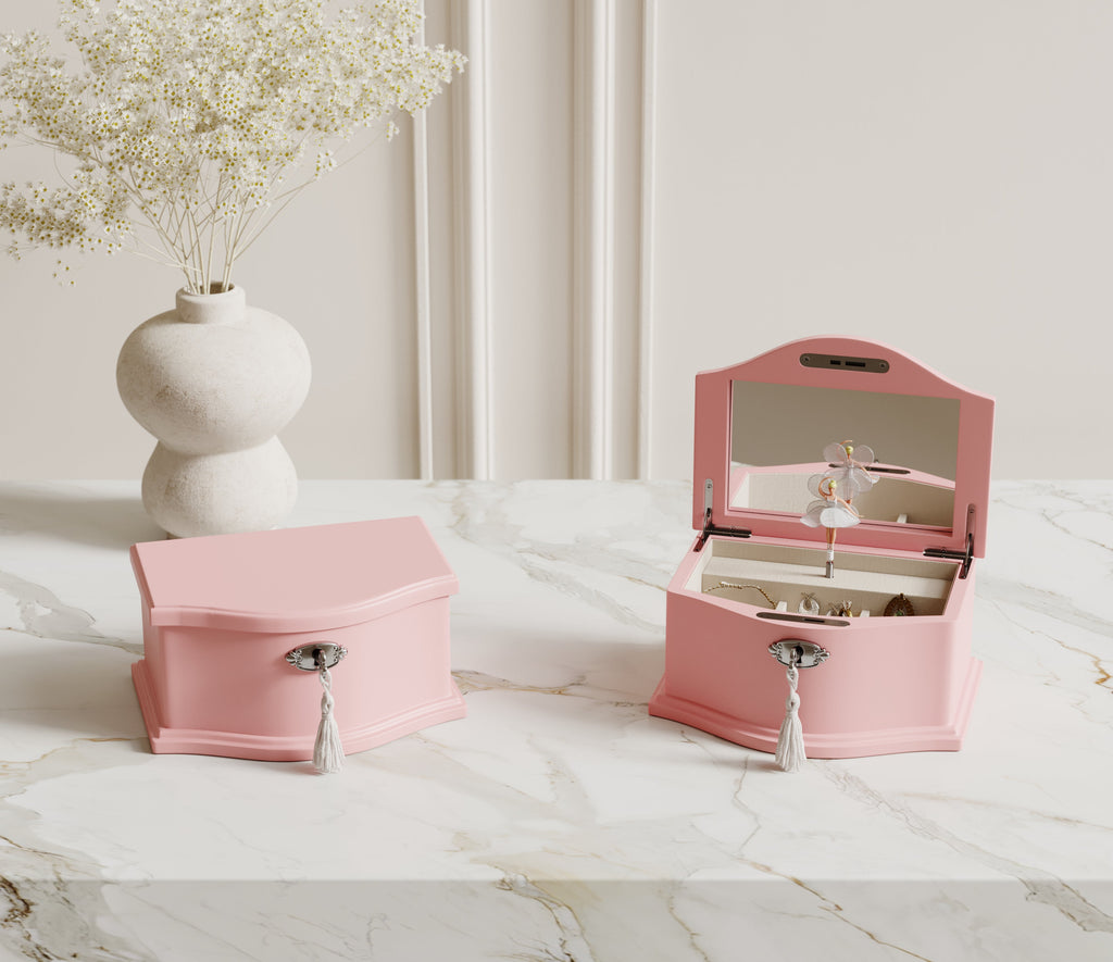Medium pink ballerina music box on a dresser
