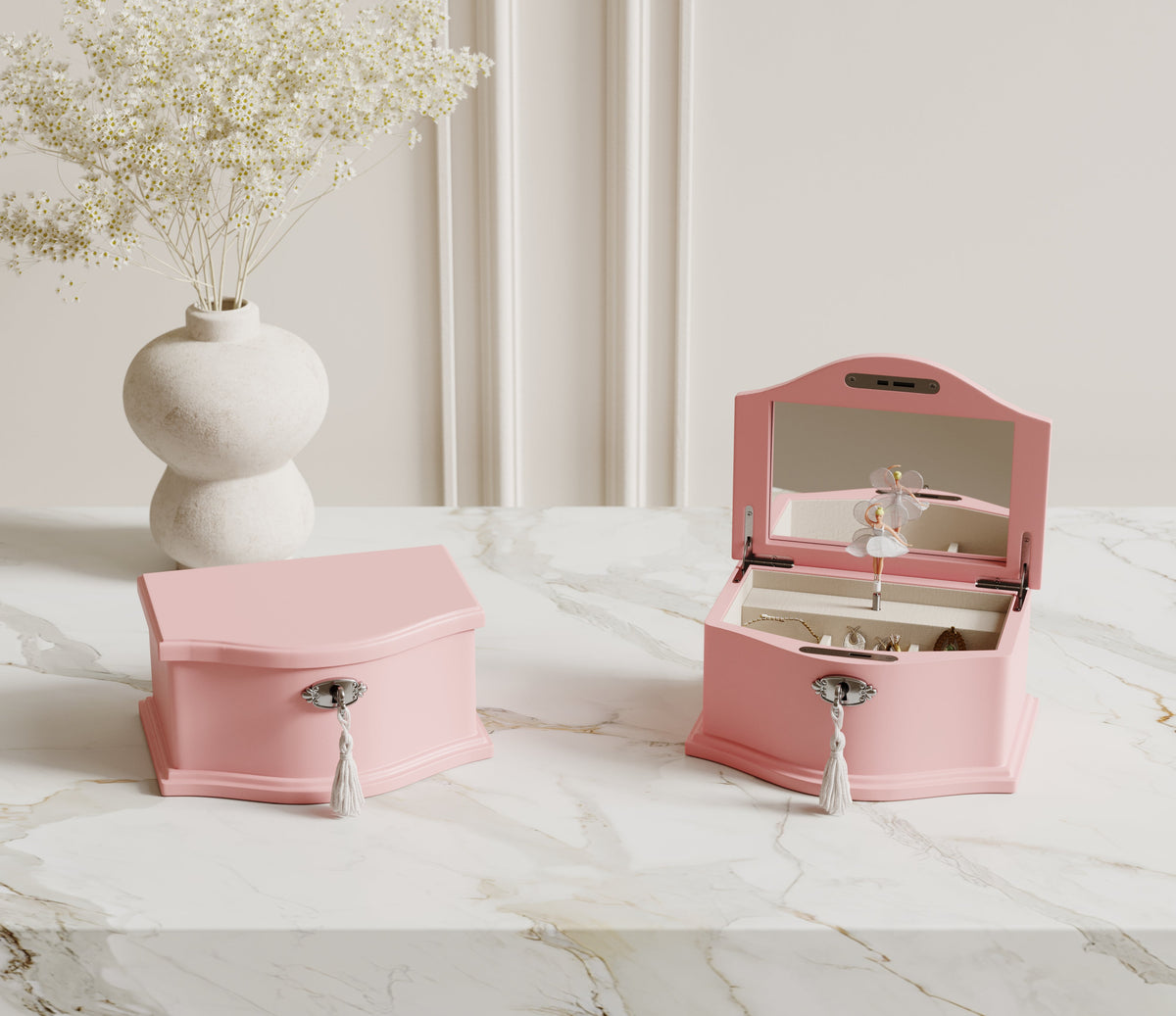 Medium pink ballerina music box on a dresser