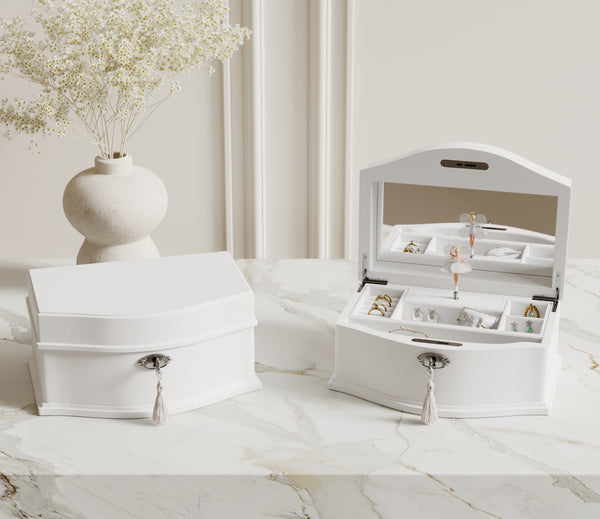 White ballerina musical jewelry boxes on a dresser