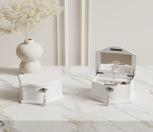 Medium white ballerina music box on a dresser