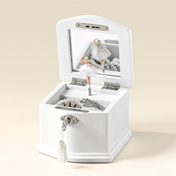 Small white jewelry box open with spinning ballerina