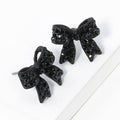 Pave crystal bow stud earrings, jet black
