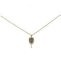 Pave crystal pickleball paddle pendant necklace, gold tone with black stones, on white background