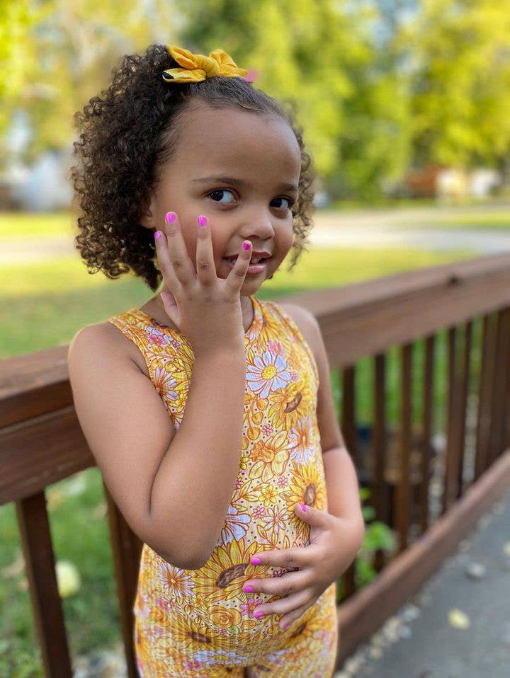Girl with painted nails on a deck