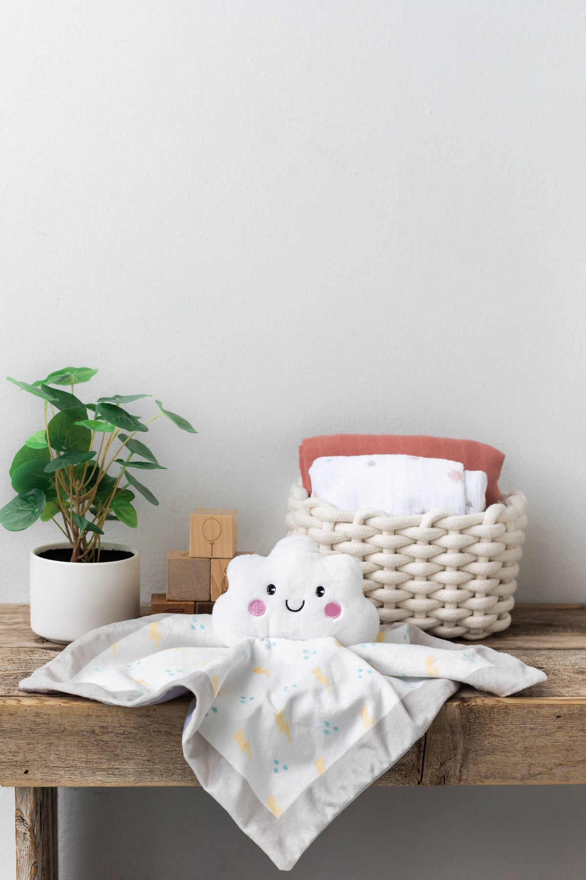 Plush minky cloud lovey blanket, white, in nursery