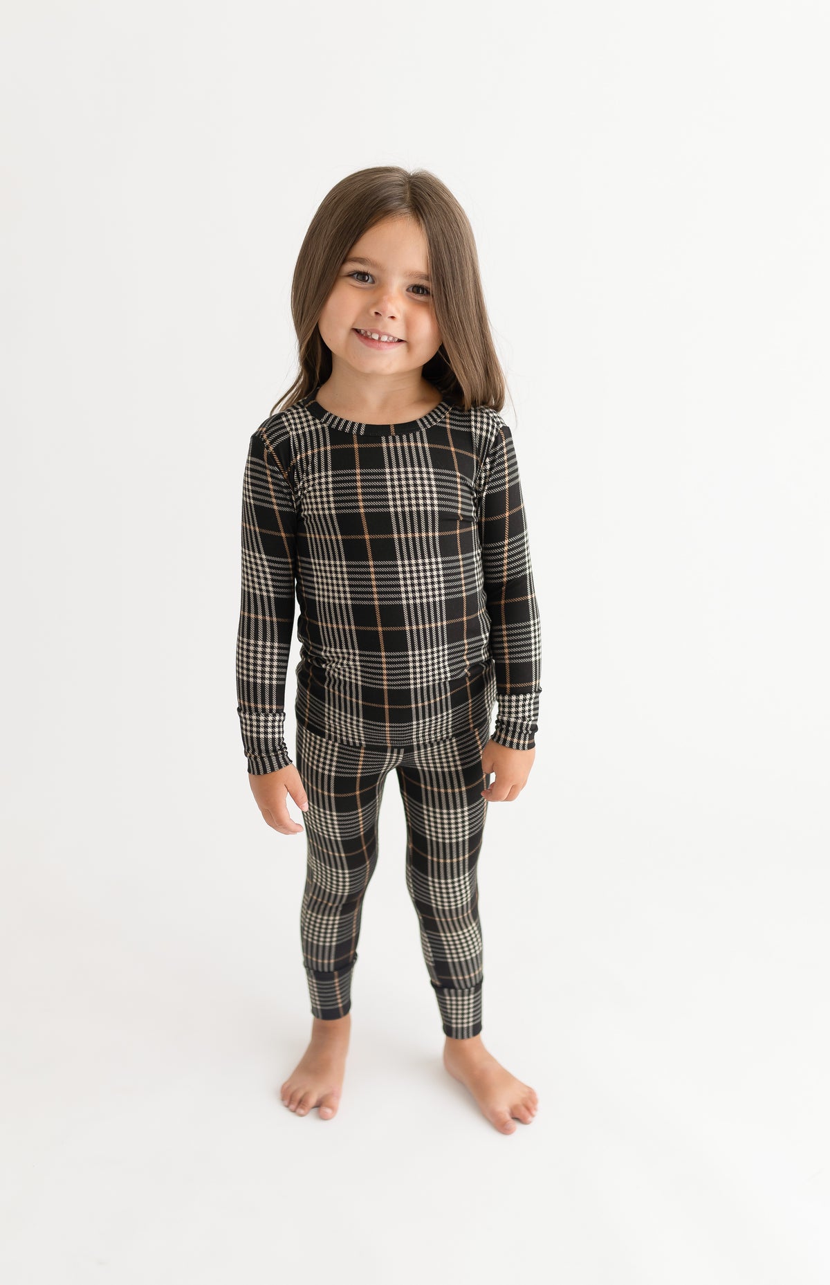 Posh Peanut bamboo pajama set, Sanders black plaid, worn by girl