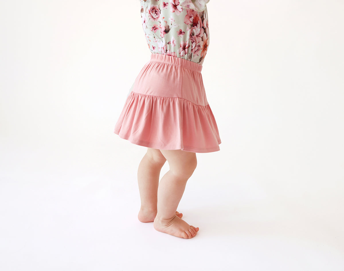 Posh Peanut bamboo tiered ruffle skirt, autumn blush, worn by toddler
