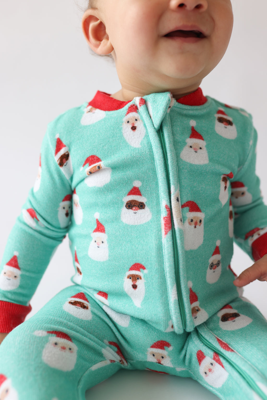 Posh Peanut Pacci fleece zip footie, Santa medley, print detail