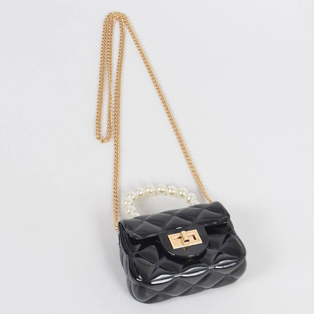 Quilted black jelly handbag with pearl handle, worn cross body