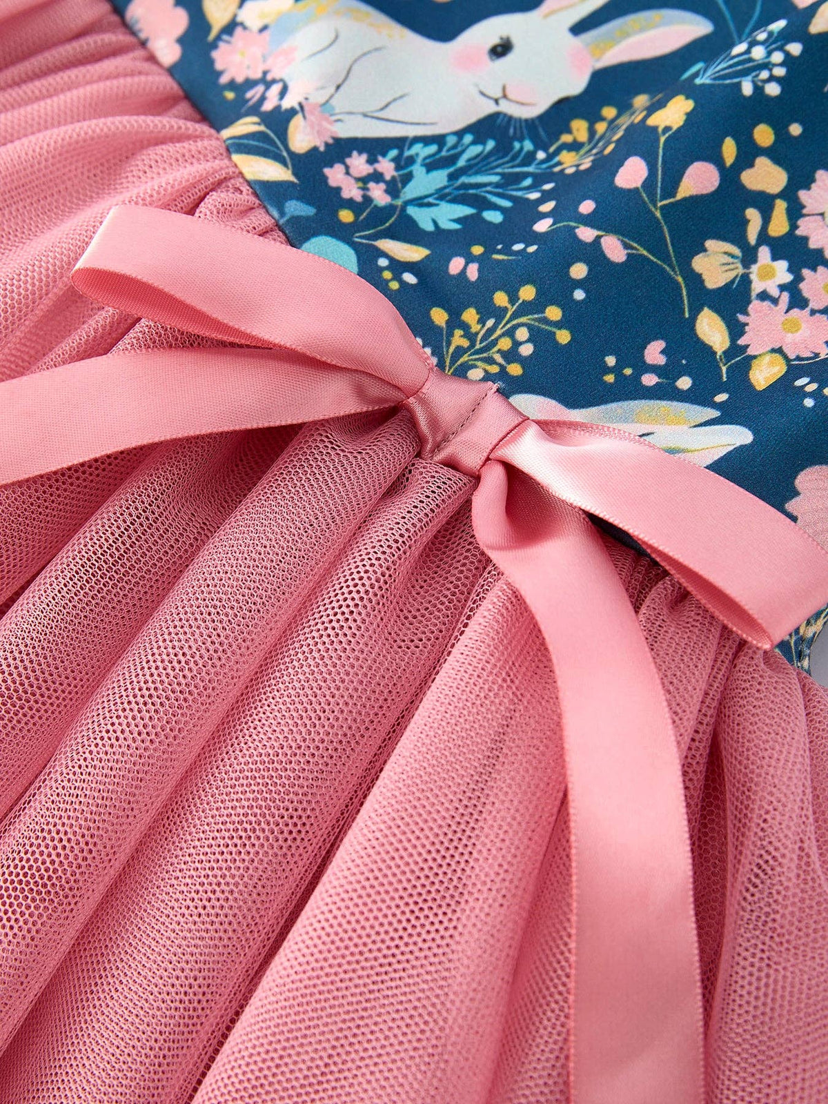 Girls bunny garden print tulle twirl dress in teal and pink, close-up of the bow