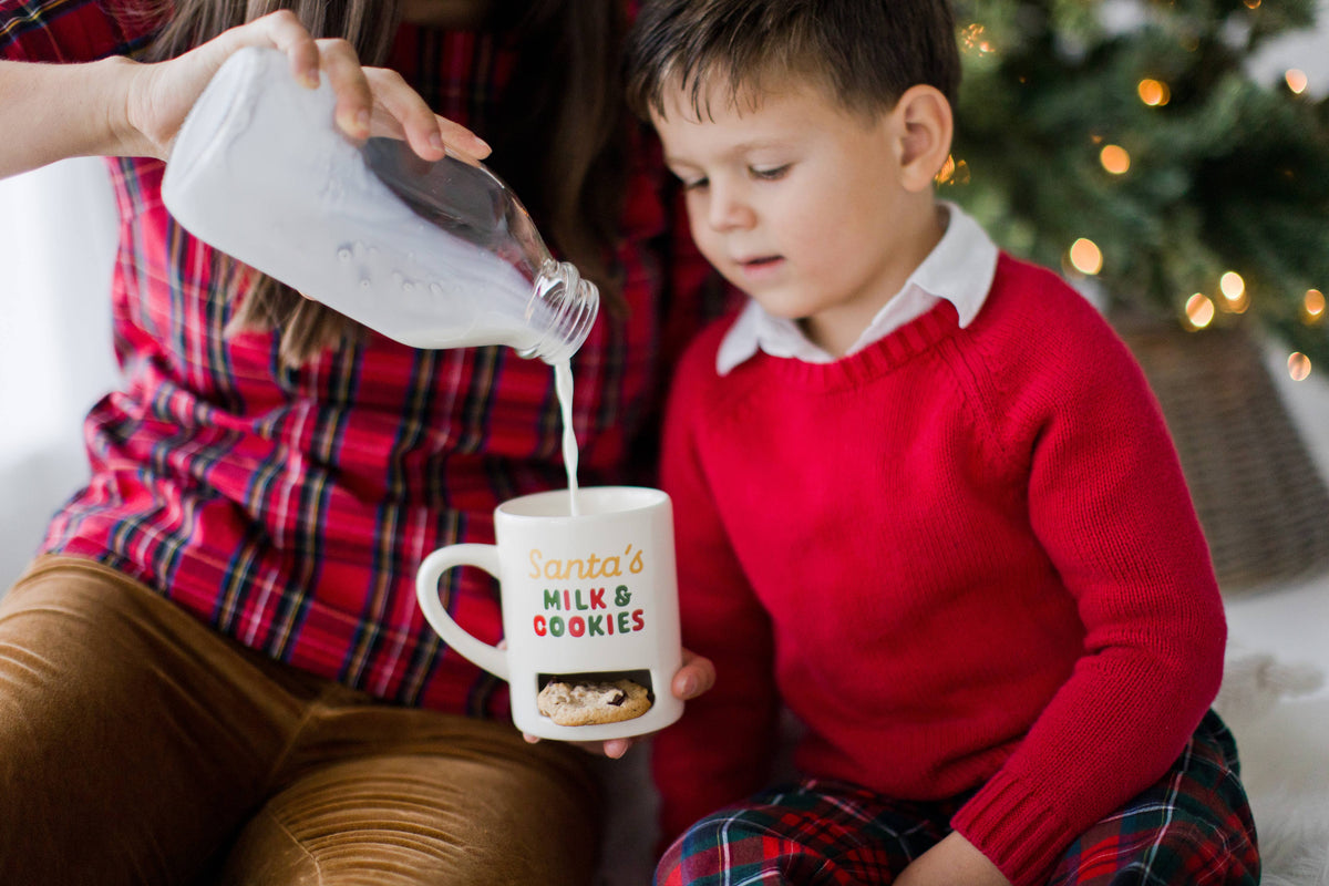 Mom pouring milk into the Santa's mug