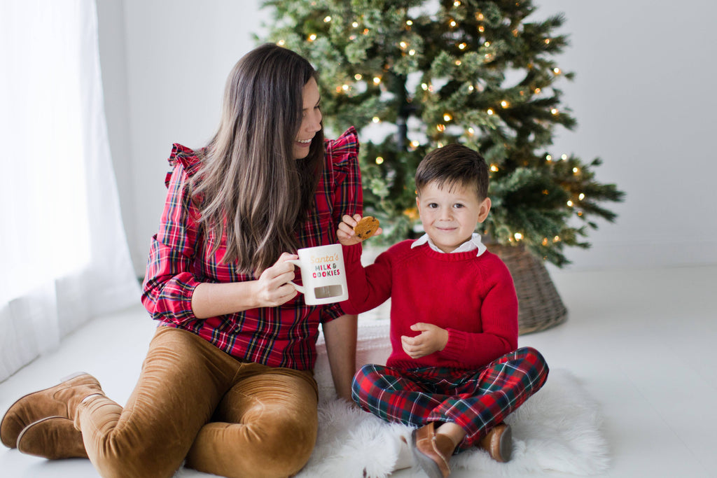 Mom and son with the Santa's Milk and Cookies mug