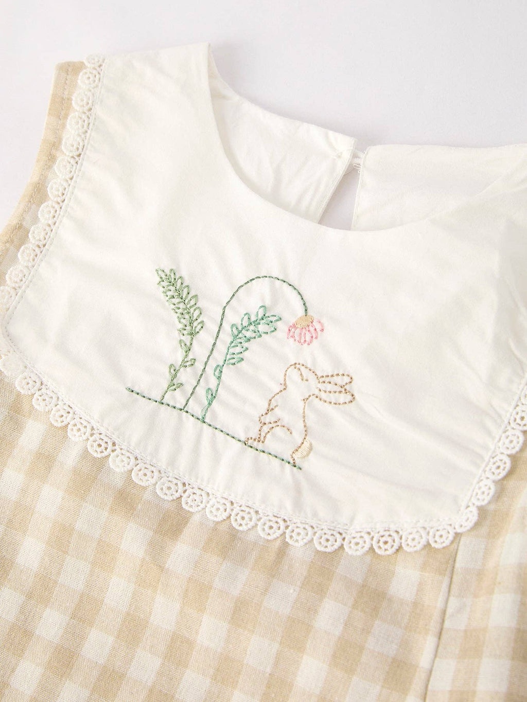 Girls natural gingham flare dress with embroidered bunny bib, close-up of the embroidered bunnies