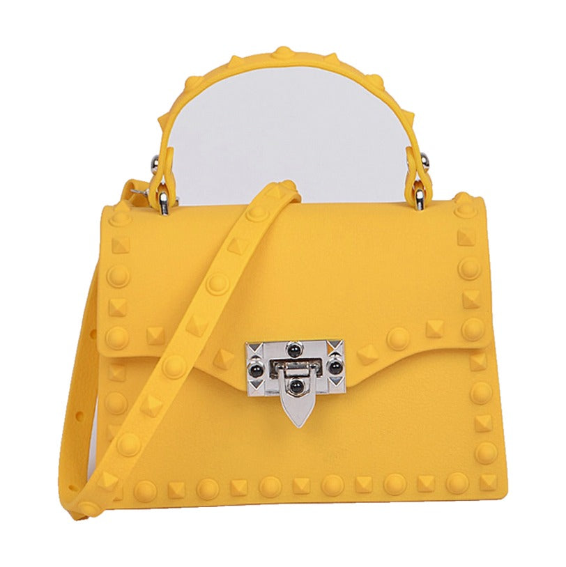 Studded marigold yellow crossbody purse, front view