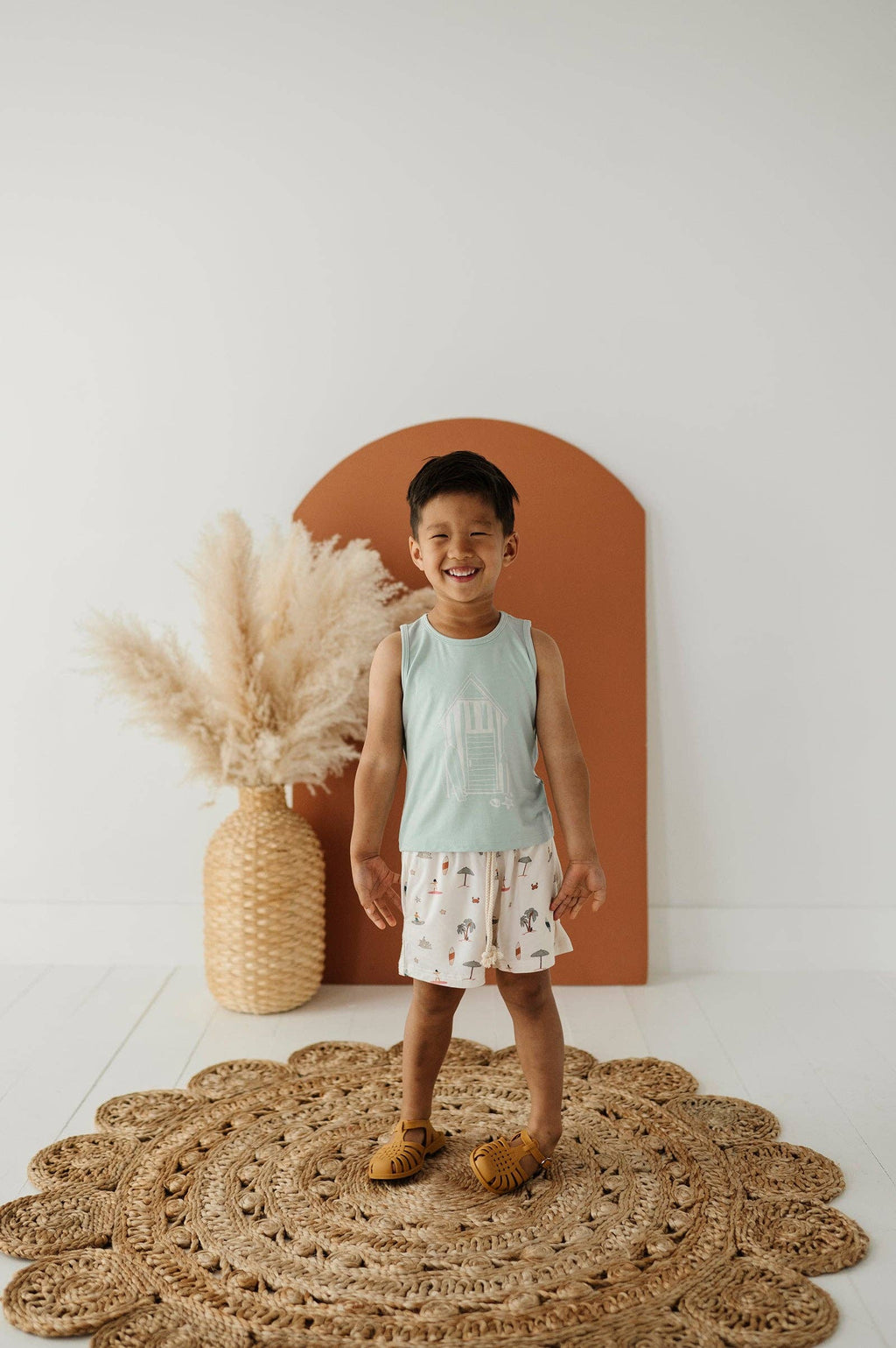 Boys bamboo tank top, beach shack sky blue, worn by boy