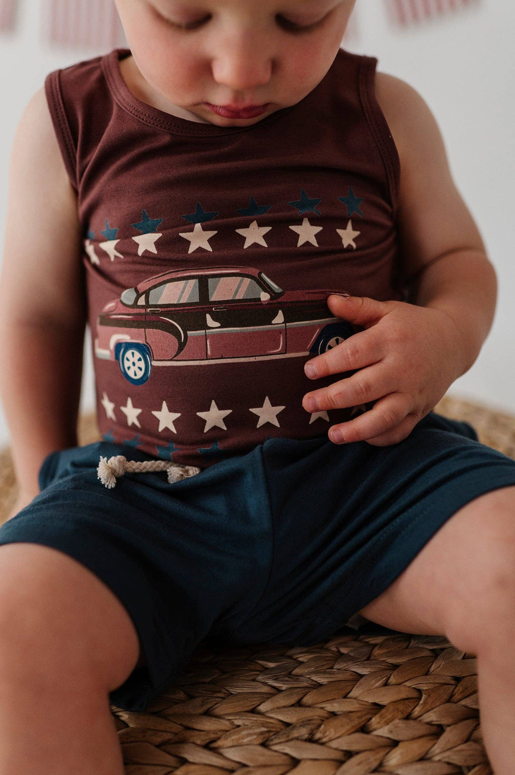 Boys bamboo Americana tank top, hot rod brick, worn by boy seated