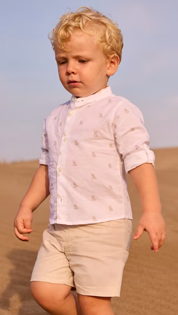 Toddler boy wearing the Mayoral oat linen Bermuda shorts