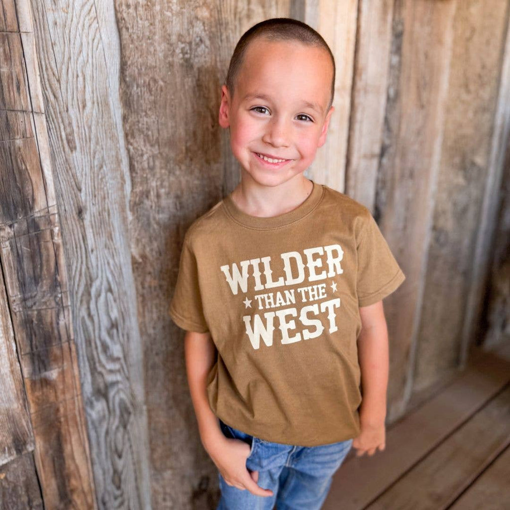 Kids mocha Wilder Than The West graphic t-shirt, on a boy