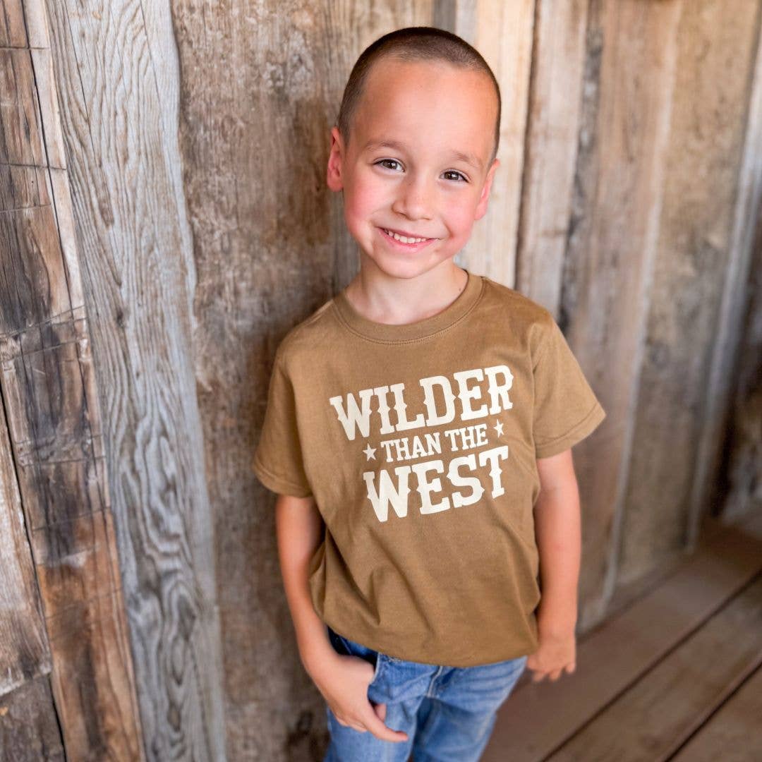 Kids mocha Wilder Than The West graphic t-shirt, on a boy