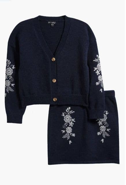 Navy cardigan and matching skirt set with white floral embroidery on the sleeves and skirt