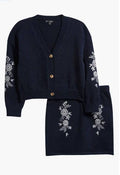 Navy cardigan and matching skirt set with white floral embroidery on the sleeves and skirt