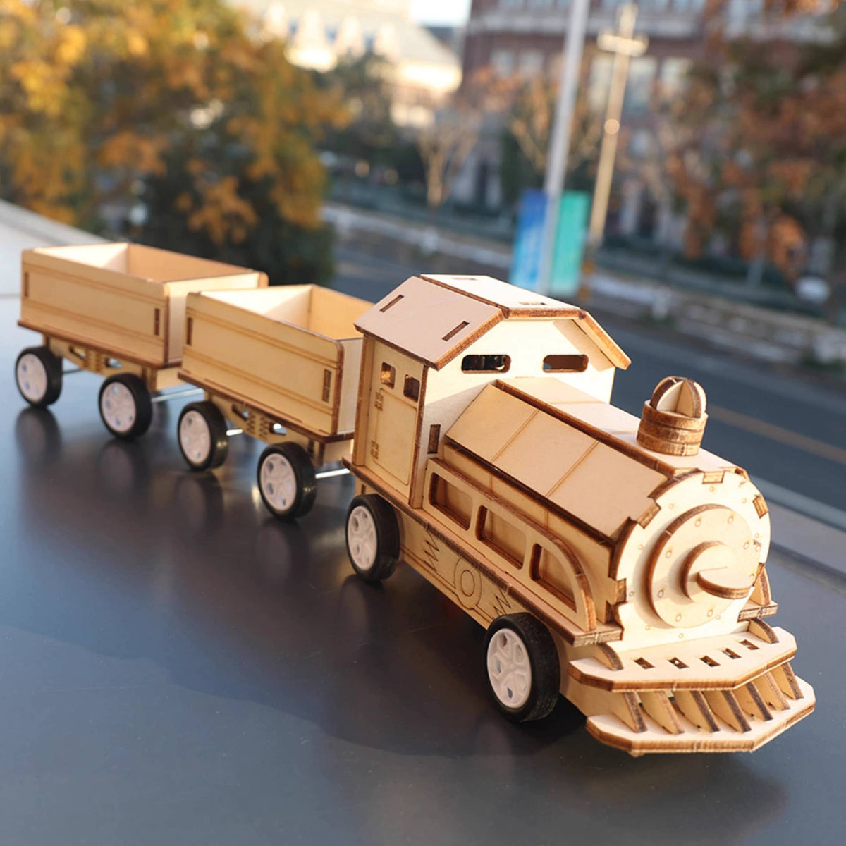 Wooden DIY STEM kit, battery powered train, front view