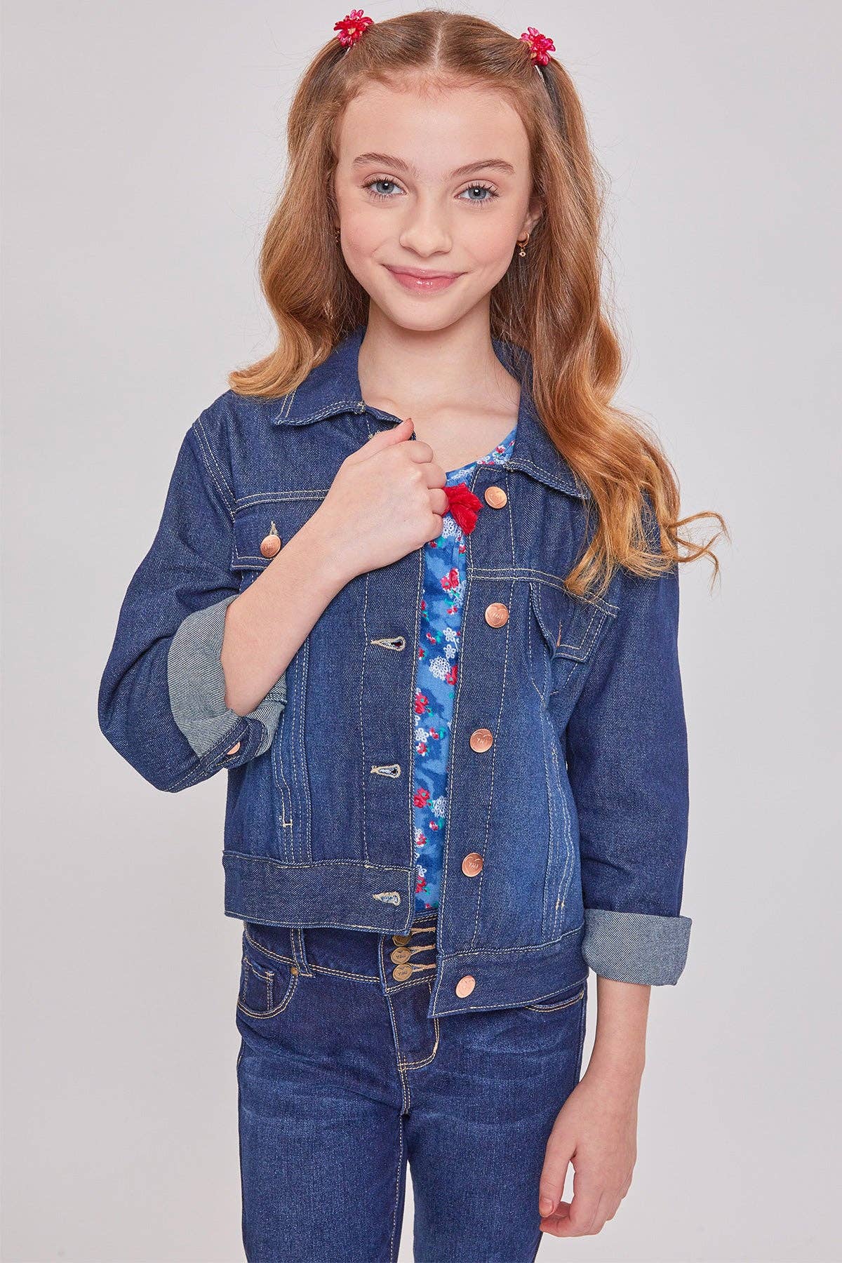 Girls medium wash classic denim jacket, front view with hand in pocket
